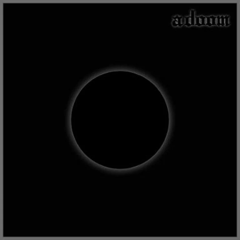 a doom album cover. It is black with a circle in the center.